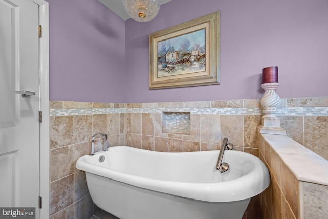 3219 Sunset Ave, Norristown, PA 19403 - bathroom featuring tile walls, a freestanding bath, and a wainscoted wall