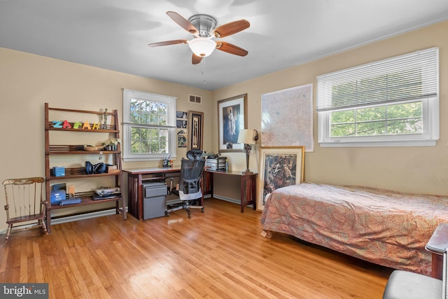 3219 Sunset Ave, Norristown, PA 19403 - bedroom featuring multiple windows, light wood-style floors, a desk, and ceiling fan