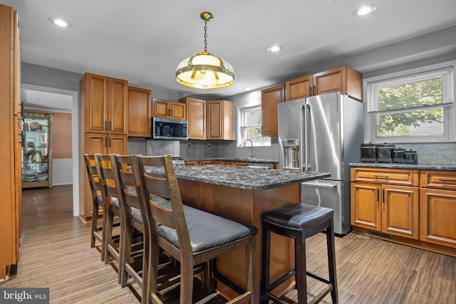 3219 Sunset Ave, Norristown, PA 19403 - kitchen with stainless steel appliances, a breakfast bar, backsplash, a sink, and recessed lighting