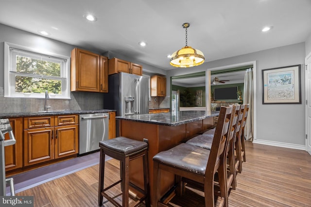 3219 Sunset Ave, Norristown, PA 19403 - kitchen featuring appliances with stainless steel finishes, a sink, brown cabinets, backsplash, and recessed lighting
