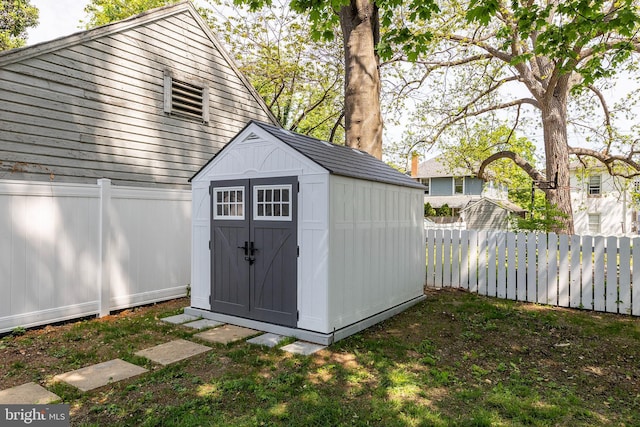 view of shed featuring a fenced backyard