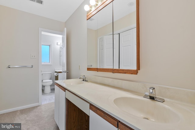 14640 Balsam Ct, Issue, MD 20645 - full bath featuring a sink, double vanity, toilet, and baseboards