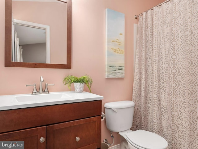 bathroom with toilet and vanity