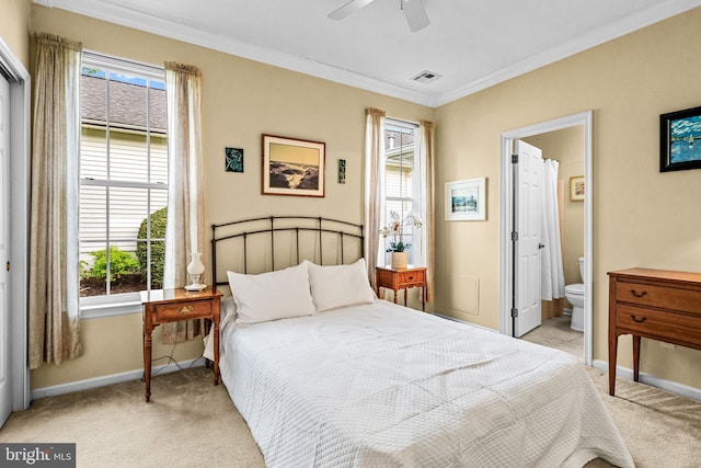 bedroom with multiple windows, light colored carpet, visible vents, crown molding, and baseboards