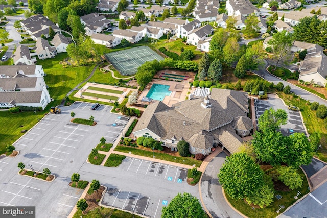 birds eye view of property with a residential view