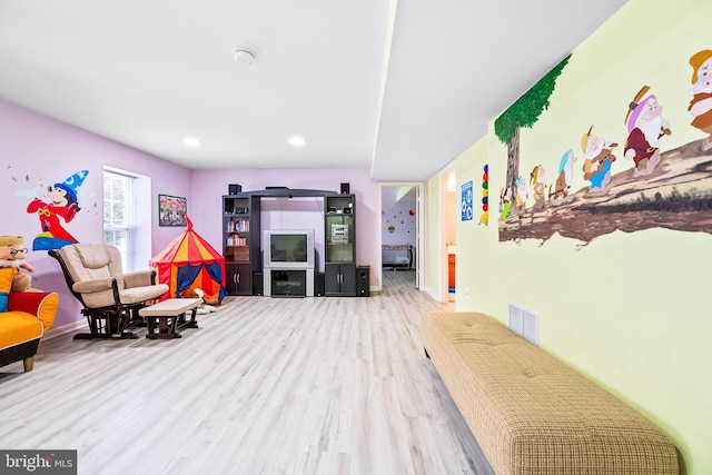 playroom featuring wood finished floors, recessed lighting, and baseboards
