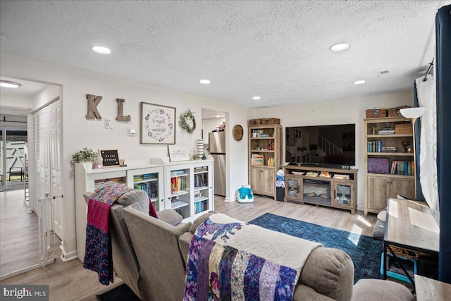 1653 Forest Park, District Heights, MD 20747 - living area featuring recessed lighting, a textured ceiling, and wood finished floors