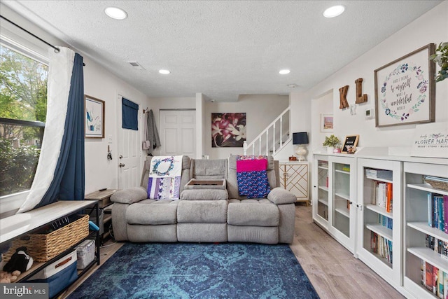 1653 Forest Park, District Heights, MD 20747 - living room with recessed lighting, stairs, a textured ceiling, and wood finished floors