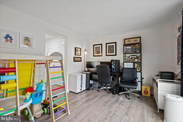 1653 Forest Park, District Heights, MD 20747 - home office featuring a textured ceiling and wood finished floors