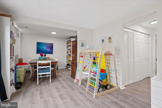 1653 Forest Park, District Heights, MD 20747 - rec room with visible vents, baseboards, and wood finished floors