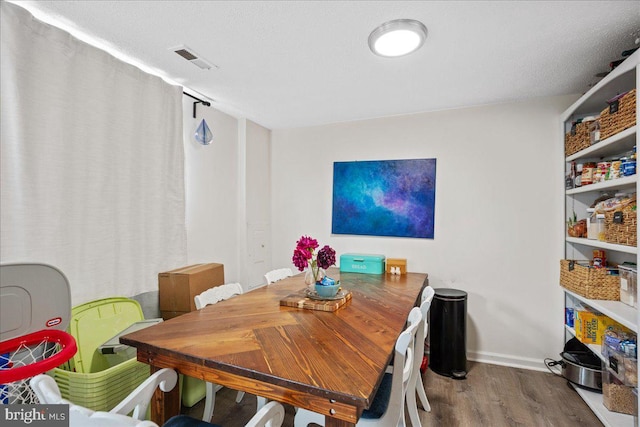 1653 Forest Park, District Heights, MD 20747 - dining room with baseboards, wood finished floors, and visible vents