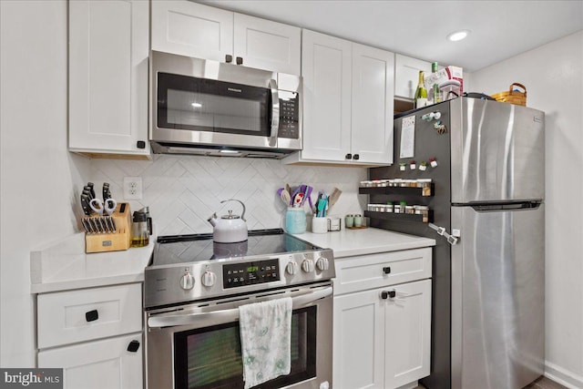 1653 Forest Park, District Heights, MD 20747 - kitchen with light countertops, tasteful backsplash, white cabinets, and stainless steel appliances
