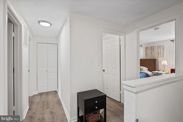 1653 Forest Park, District Heights, MD 20747 - corridor featuring baseboards, a textured ceiling, and wood finished floors