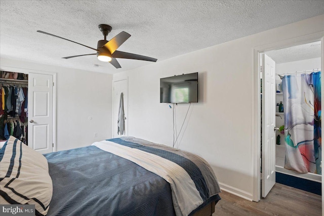 1653 Forest Park, District Heights, MD 20747 - bedroom with a closet, wood finished floors, baseboards, ceiling fan, and a textured ceiling