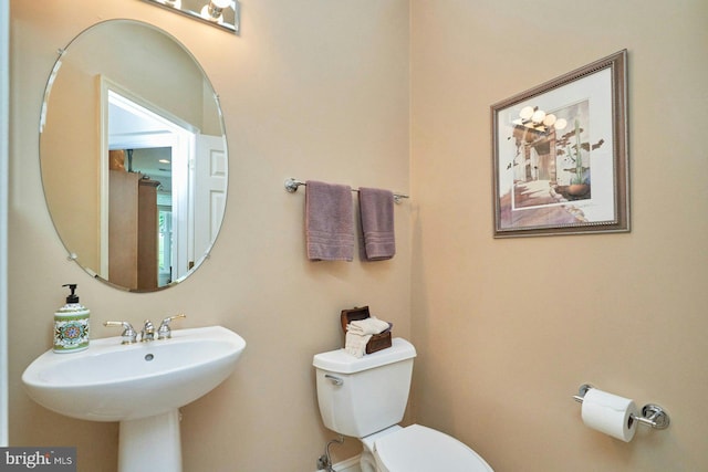 bathroom featuring a sink and toilet