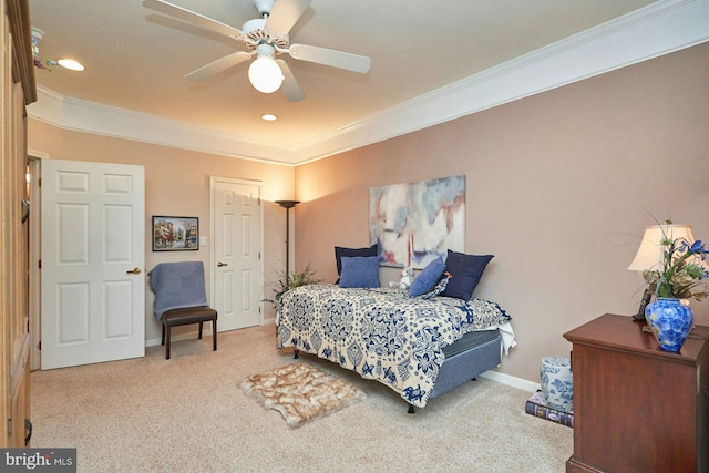 carpeted bedroom with baseboards, recessed lighting, ceiling fan, and crown molding