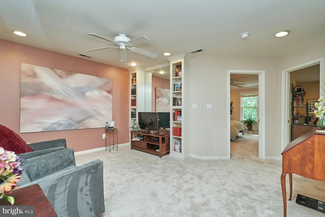carpeted living area with visible vents, baseboards, ceiling fan, and recessed lighting