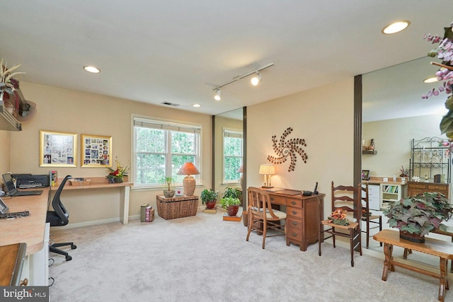 carpeted office with rail lighting, baseboards, visible vents, and recessed lighting