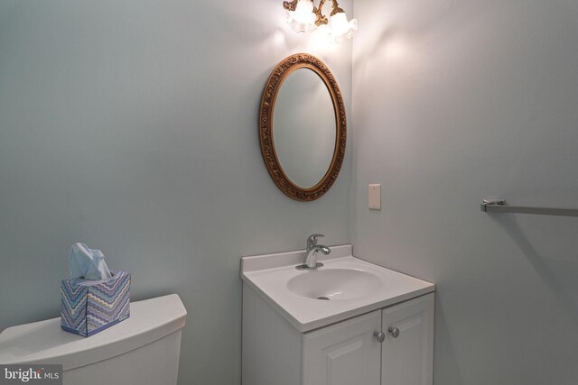 bathroom with toilet and vanity