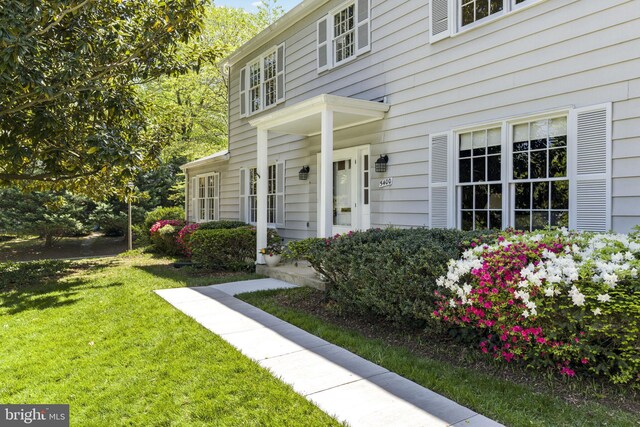 property entrance with a yard