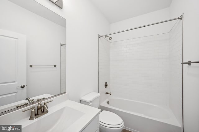 bathroom with toilet, bathtub / shower combination, and vanity