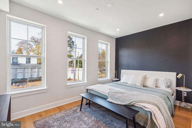 bedroom featuring recessed lighting, baseboards, and light wood finished floors