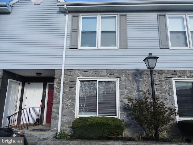 view of property exterior featuring stone siding