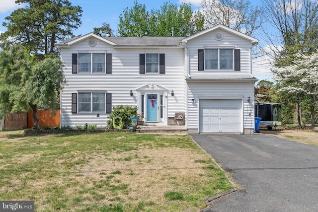13 Maricopa Trl, Browns Mills, NJ 08015 - traditional-style house with fence, driveway, a front lawn, and a garage
