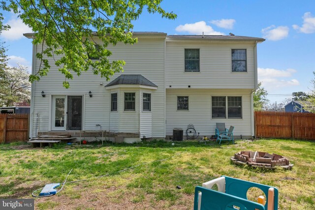 13 Maricopa Trl, Browns Mills, NJ 08015 - rear view of property featuring central AC, fence, and a yard