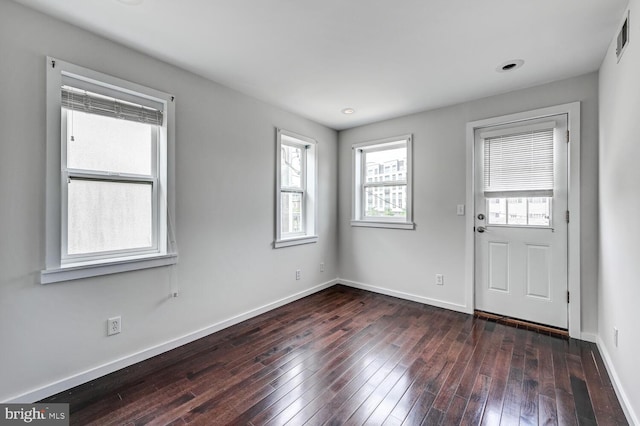 136 W Ostend St, Baltimore, MD 21230 - foyer entrance with healthy amount of natural light, dark wood-type flooring, and baseboards