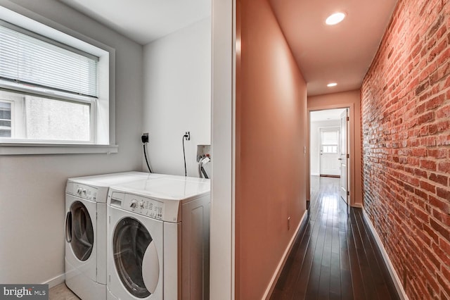 136 W Ostend St, Baltimore, MD 21230 - laundry room with brick wall, baseboards, washing machine and clothes dryer, wood-type flooring, and recessed lighting