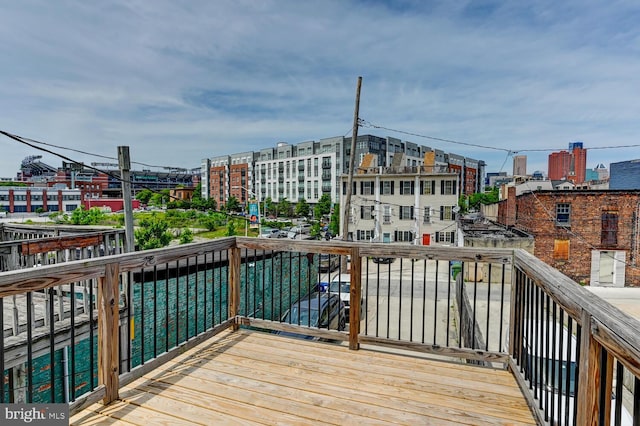 136 W Ostend St, Baltimore, MD 21230 - wooden deck featuring a city view
