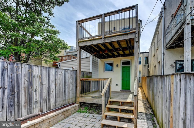 136 W Ostend St, Baltimore, MD 21230 - back of property with a fenced backyard and a wooden deck