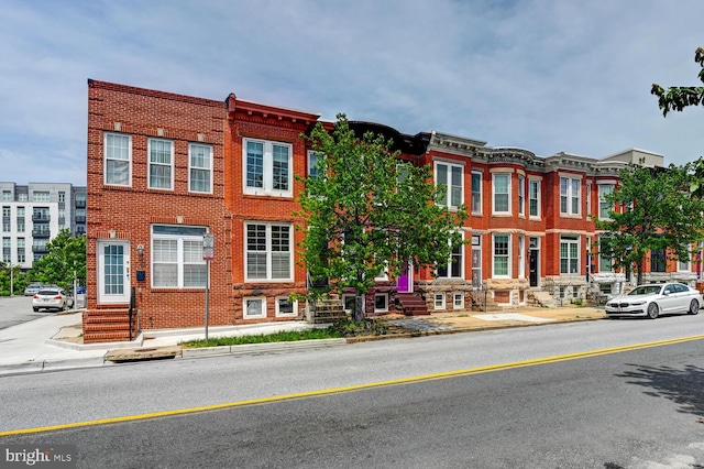 136 W Ostend St, Baltimore, MD 21230 - view of property with brick siding and entry steps