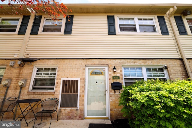 view of front of house with brick siding