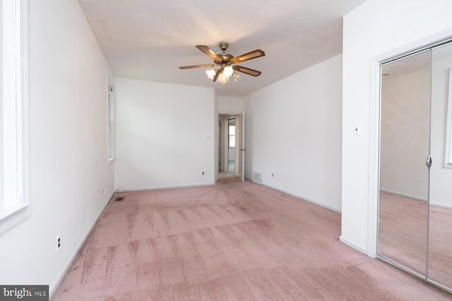 interior space featuring carpet flooring, a closet, and visible vents