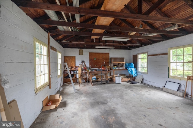 garage with concrete block wall