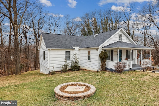 4527 Deer Park Dr, Temple Hills, MD 20748 - view of front of house with a shingled roof, covered porch, and a front yard