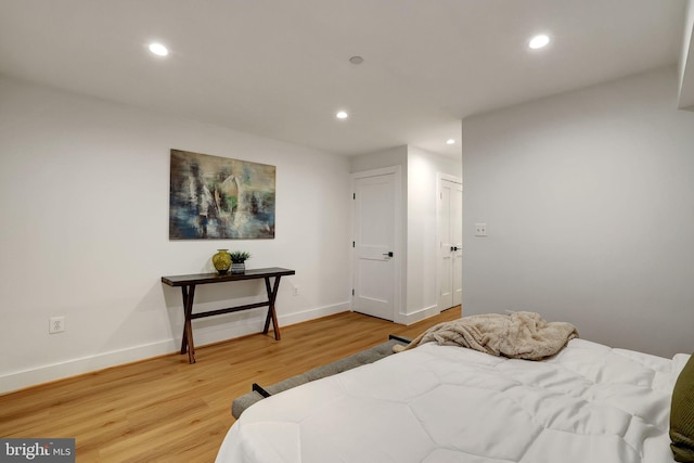 bedroom featuring recessed lighting, baseboards, and light wood-style floors