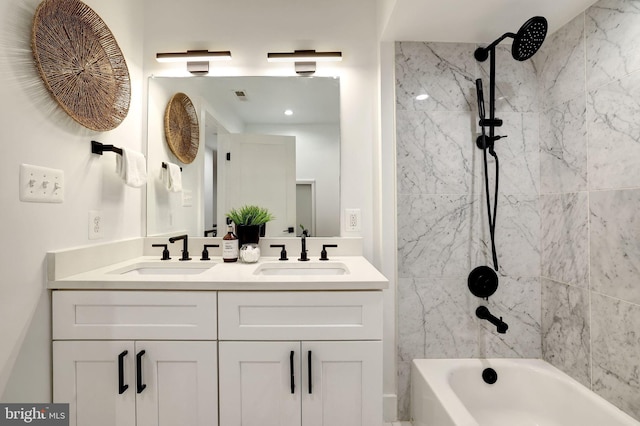 full bath featuring double vanity, shower / washtub combination, a sink, and visible vents