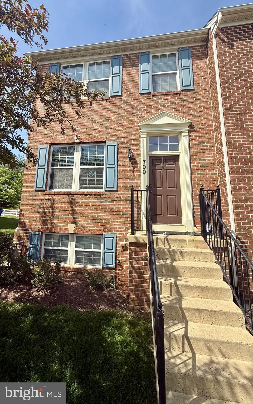 view of property featuring brick siding