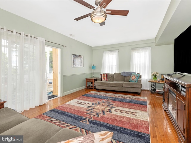 7214 Honeybush Dr, Mount Airy, MD 21771 - living area with wood finished floors, ceiling fan, and baseboards