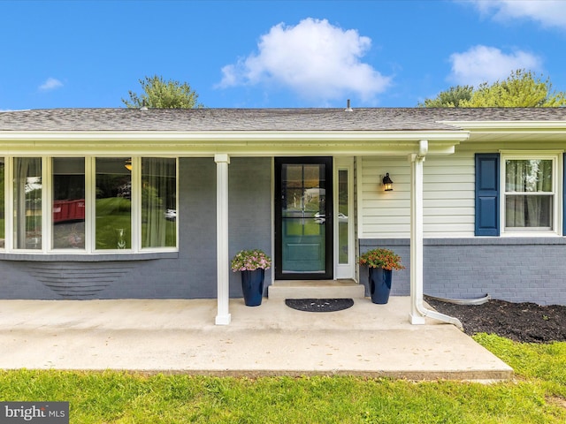 7214 Honeybush Dr, Mount Airy, MD 21771 - entrance to property featuring brick siding and covered porch