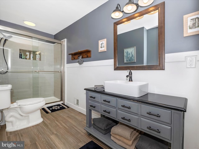 7214 Honeybush Dr, Mount Airy, MD 21771 - bathroom with toilet, a shower stall, wood finished floors, vanity, and baseboards