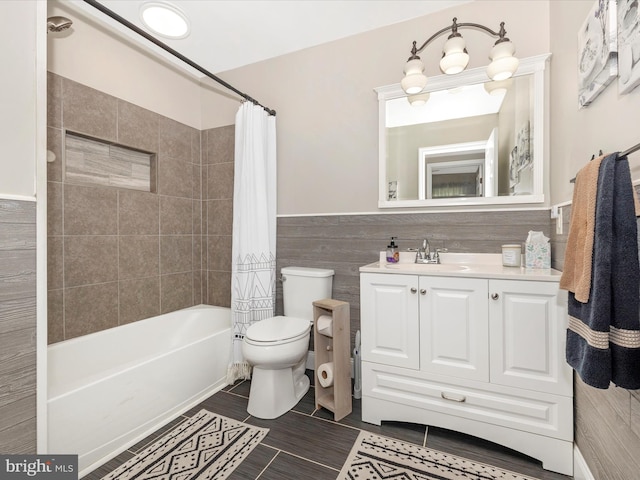 7214 Honeybush Dr, Mount Airy, MD 21771 - bathroom with toilet, shower / tub combo, vanity, and a wainscoted wall