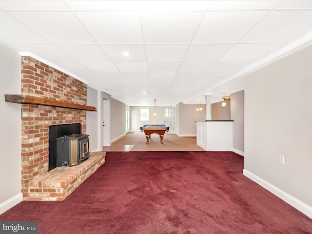 7214 Honeybush Dr, Mount Airy, MD 21771 - unfurnished living room featuring a wood stove, dark colored carpet, baseboards, and billiards table