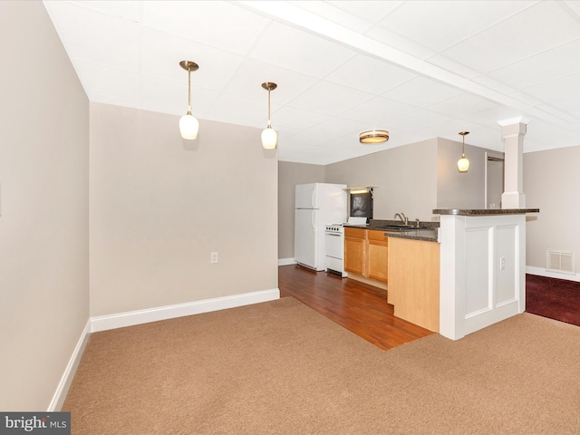 7214 Honeybush Dr, Mount Airy, MD 21771 - kitchen featuring dark colored carpet, freestanding refrigerator, baseboards, hanging light fixtures, and a drop ceiling