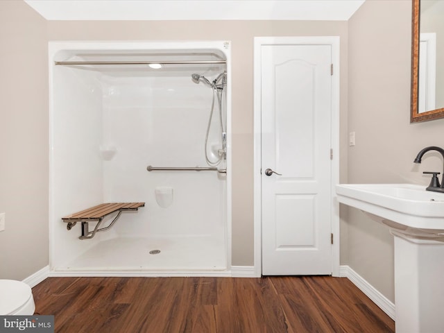 7214 Honeybush Dr, Mount Airy, MD 21771 - bathroom with wood finished floors, a shower, and baseboards