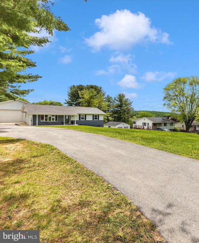 7214 Honeybush Dr, Mount Airy, MD 21771 - ranch-style home featuring asphalt driveway, a front lawn, and a garage