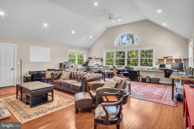 living area with recessed lighting, ceiling fan, wood finished floors, and high vaulted ceiling